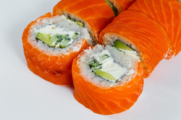 Sushi rolls classic with fresh salmon and cream cheese. Japanese traditional food