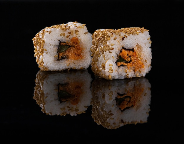 Sushi and rolls close-up on a black background