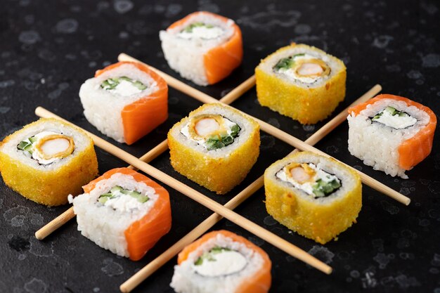 Sushi and rolls cooked on the table