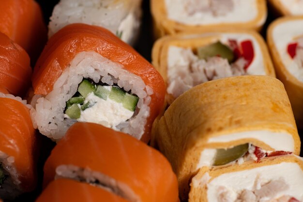 Sushi and rolls cooked on the table