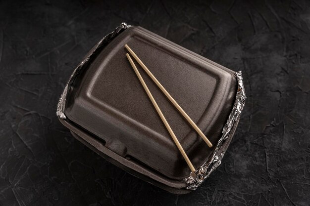 Sushi rolls in a plastic thermo container Takeaway food