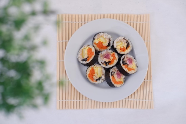 Sushi rolls on a plate on a white background Japanese food