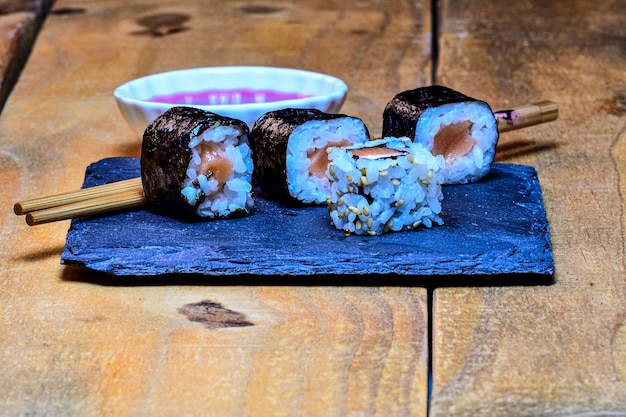 Sushi rolls served on a board