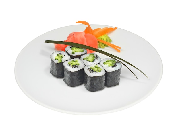 Sushi rolls with cucumber seeds and nori with pickled ginger and wasabi on white round plate