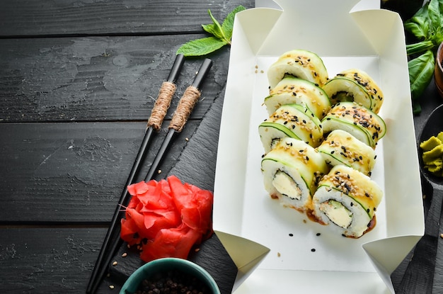 Sushi rolls with cucumber sesame and Philadelphia cheese Japanese food Traditional sushi Top view