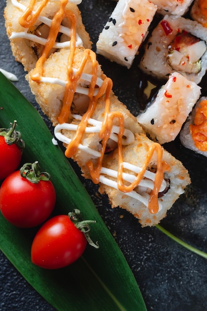 Sushi rolls with sauce close-up