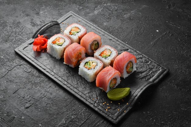 Sushi rolls with tuna and night stone plate. Top view.