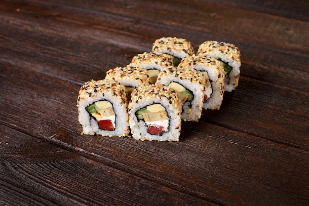 Sushi rolls on a wooden table