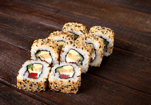 Sushi rolls on a wooden table