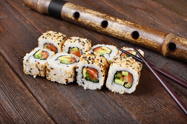 Sushi rolls on a wooden table