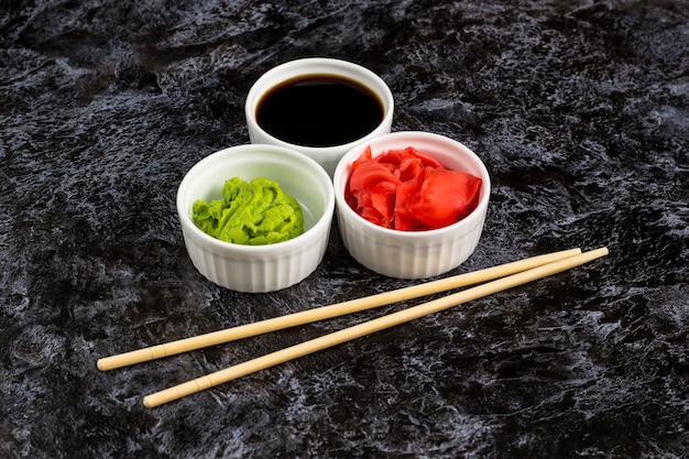 Sushi sauces set with chopsticks