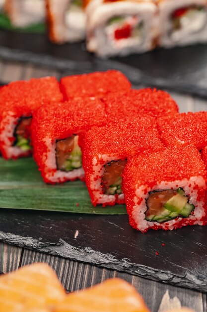 Sushi served on a slate plate in a restaurant