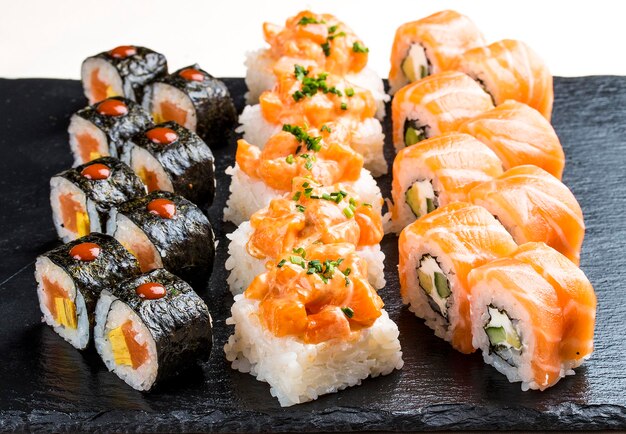 Sushi set on ceramic boards On white background