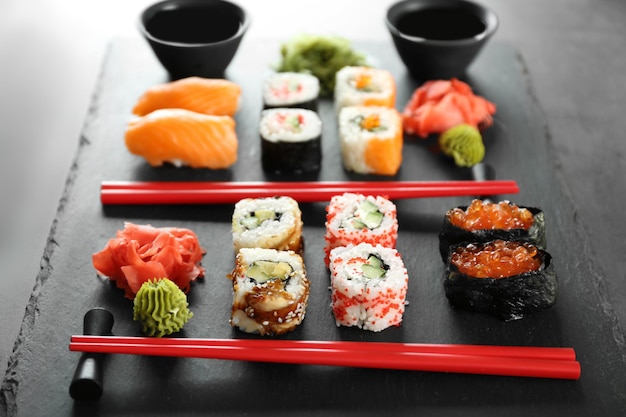 Sushi set and chopsticks on slate plate