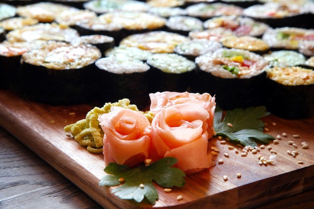 Sushi Set Different Types of Maki Sushi and Nigiri Sushi Served on dark wooden table