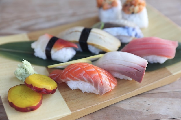 Sushi Set nigiri and sushi rolls on wood background