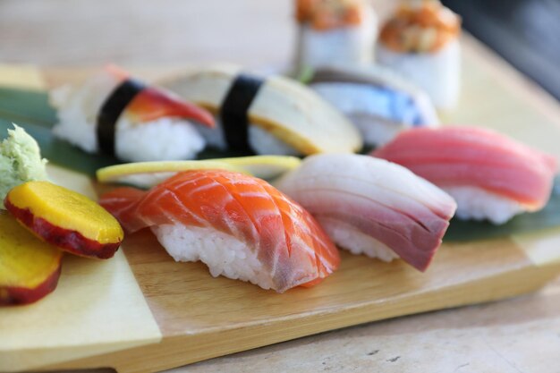 Sushi Set nigiri and sushi rolls on wood background