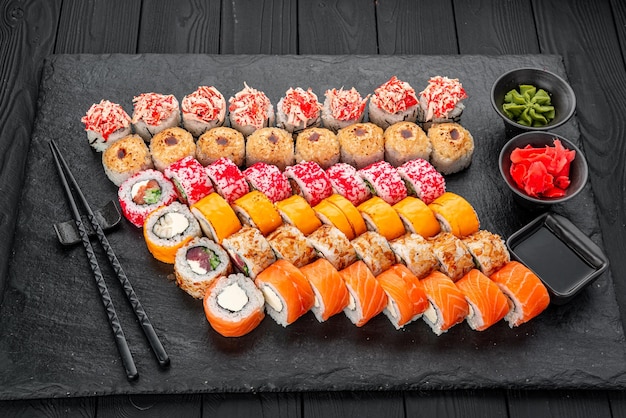 Premium Photo  Sushi set philadelphia roll california unagi black