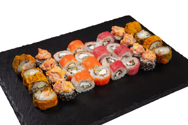 Photo sushi set served on black stone tray