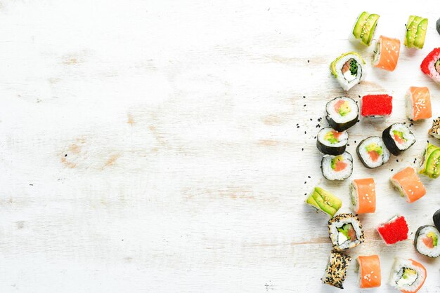 Sushi soy sauce wasabi and ginger on a white wooden background Japanese Traditional Cuisine Top view Rustic style