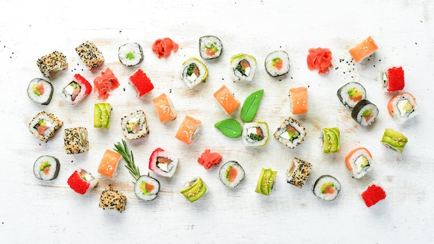 Sushi soy sauce wasabi and ginger on a white wooden background Japanese Traditional Cuisine Top view Rustic style