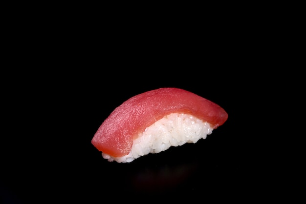 sushi tuna nigiri on black 