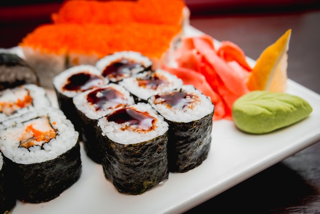 Sushi on a white plate. Rolls. The restaurant 