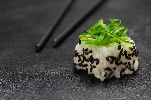 Sushi with green algae Food sticks Close up