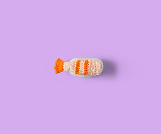 Sushi with rice and shrimp handmade in crochet and colored wool isolated Sushi amigurumi Top view