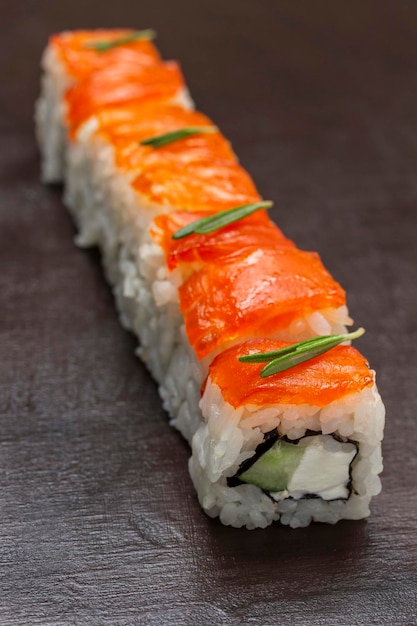 Sushi with salmon and cucumber closeup