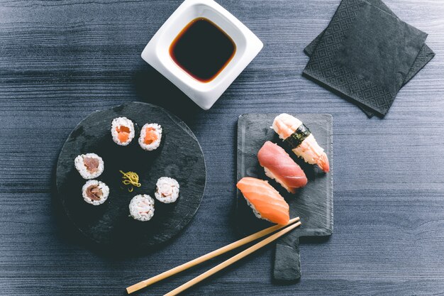 Sushi on wood table. Elegant japanese restaurant. Retro style