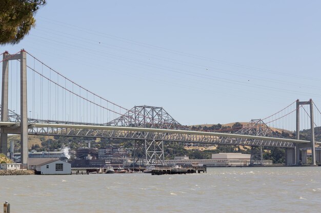 Suspension bridge over river in city