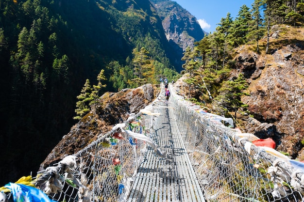 Suspension bridge over the river in Himalaya mountains, Nepal. Everest Base Camp trek, Sagarmatha national park