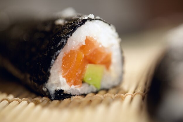 Susshi roll with salmon and avocado.