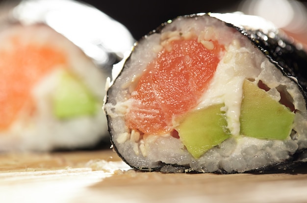 Susshi roll with salmon and avocado.