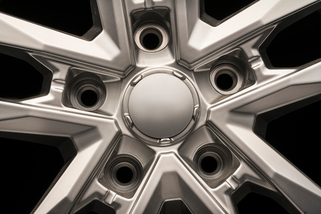 SUV Allloy wheel, close-up on a black background, cap Central part