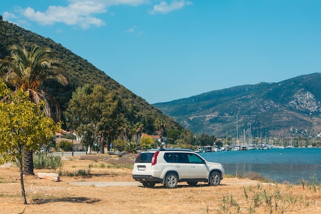 Suv car at the beach of sea bay Lefkada island