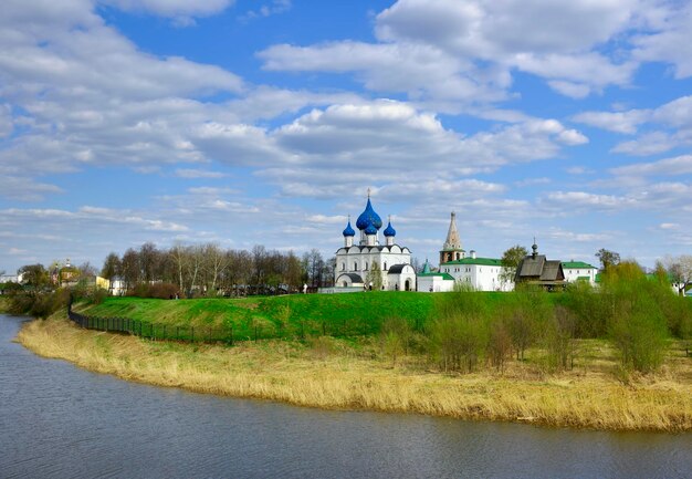 Suzdal Vladimirovskaya oblast Russia 05082022 Panorama of the Kremlin on the river bank