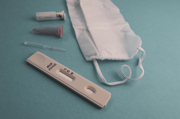 Swab test tube for 2019nCoV analyzing Coronavirus test Blue medical gloves