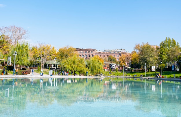 Swan lake in city park of Yerevan on November in Armenia