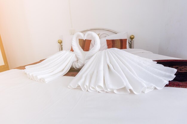 Swan shape sheets on beds at home