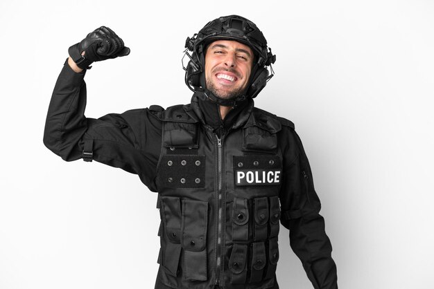 SWAT caucasian man isolated on white background doing strong gesture