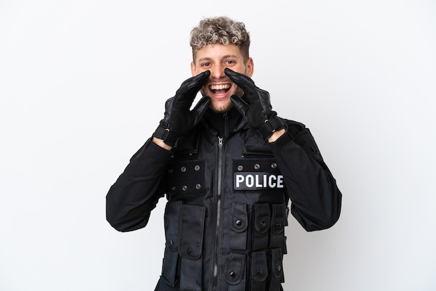 SWAT caucasian man isolated on white background shouting and announcing something