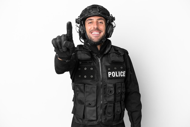 SWAT caucasian man isolated on white background showing and lifting a finger