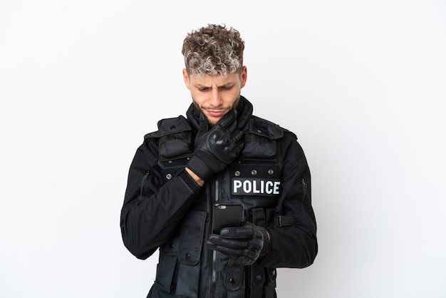 SWAT caucasian man isolated on white background thinking and sending a message