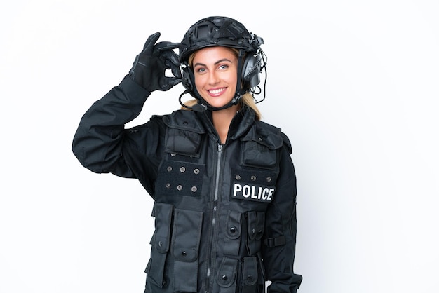 SWAT caucasian woman isolated on white background showing ok sign with fingers