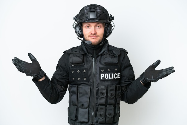 SWAT man over isolated white background having doubts while raising hands