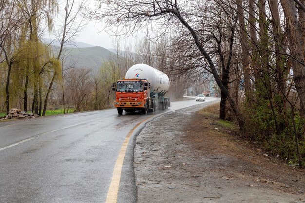 Swat Pakistan February 2022 LPG gas trailer transporting gas in heavy rain