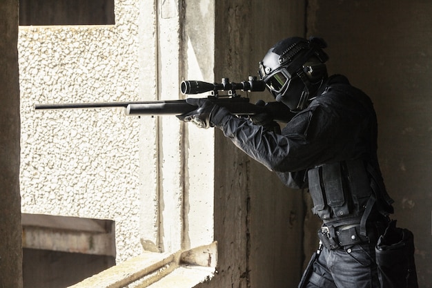 swat police operator with sniper rifle