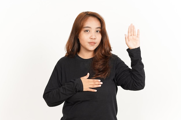 Swearing or Promise Gesture Of Beautiful Asian Woman Wearing Black Shirt Isolated On White